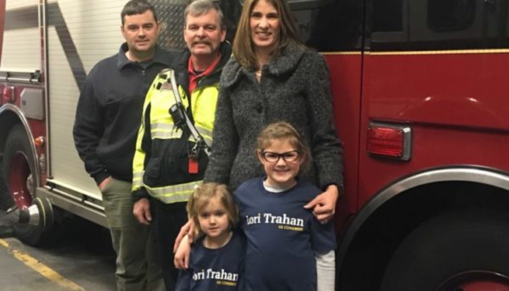 Lori Trahan joins Lt. Jim Lamy and David Greenwood, of the Westford Fire Department, and her two daughters, Caroline and Grace