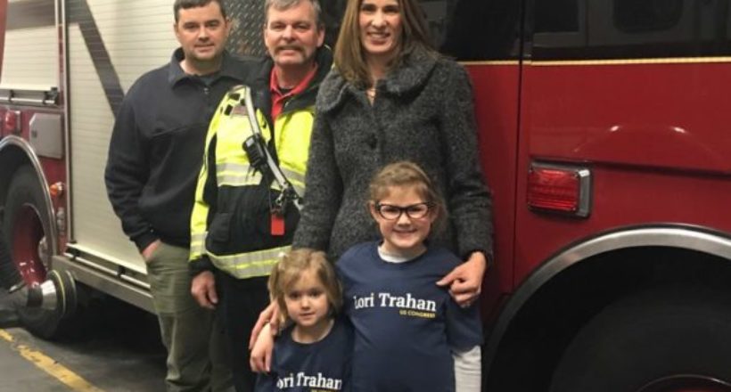Lori Trahan joins Lt. Jim Lamy and David Greenwood, of the Westford Fire Department, and her two daughters, Caroline and Grace